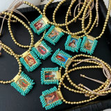 Handmade blue bead religious pendant bracelet