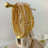Handmade white bead religious pendant bracelet