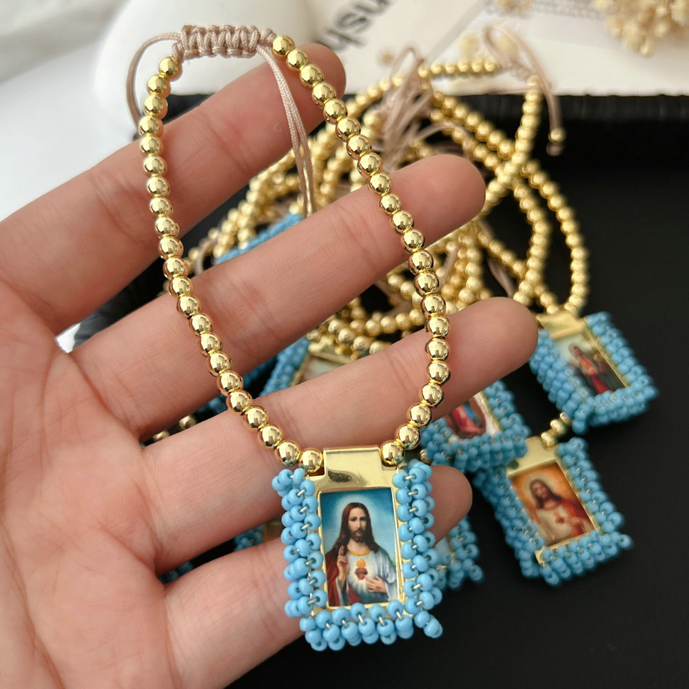 Handmade blue bead religious pendant bracelet