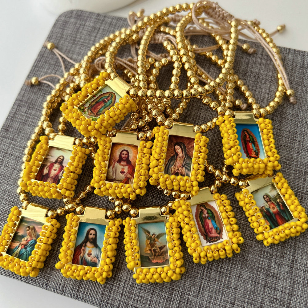 Handmade yellow bead religious pendant bracelet