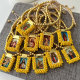Handmade yellow bead religious pendant bracelet