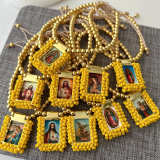Handmade yellow bead religious pendant bracelet