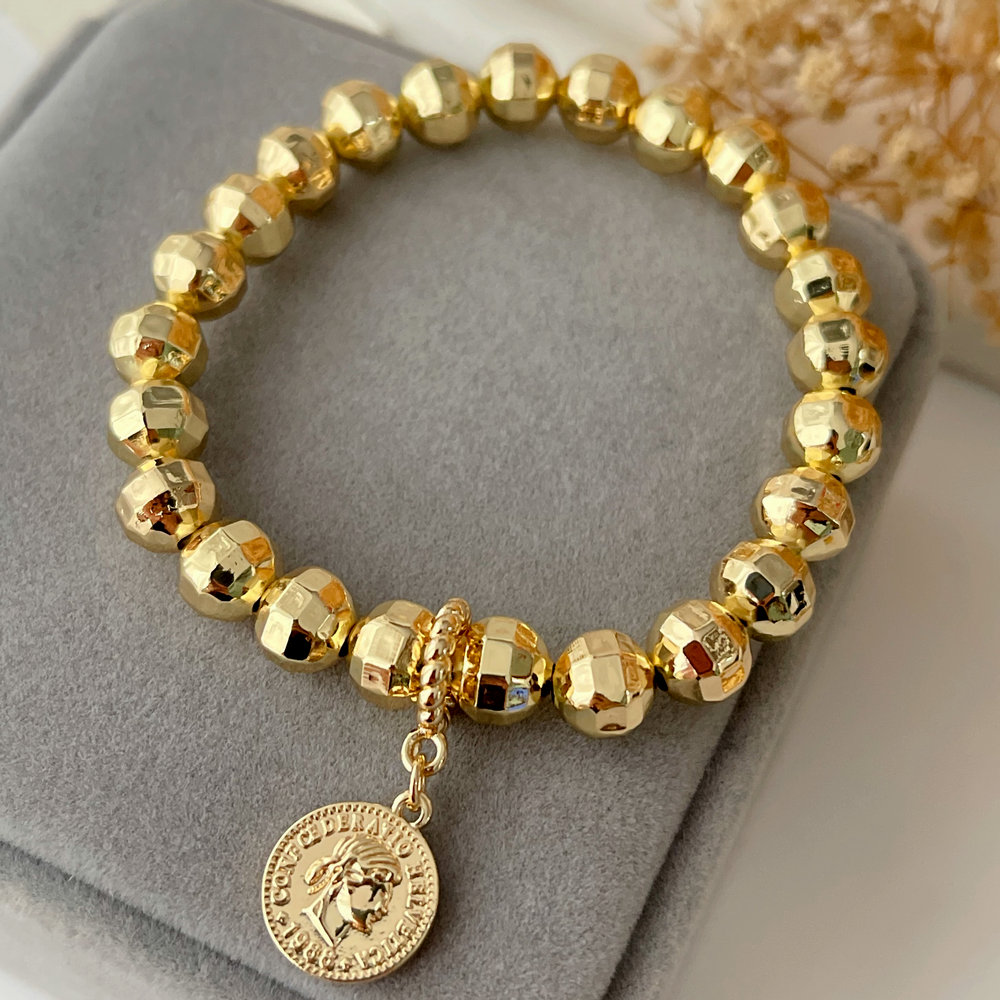 Gold ball bracelet with coin charm