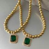 6mm gold ball with green square charm
