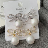 Pave bow pearl earrings