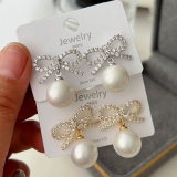 Pave bow pearl earrings