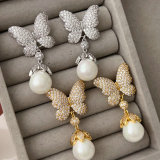 Pave butterfly pearl earrings