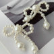 Glass pearl bow earrings