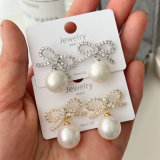 Pave bow pearl earrings