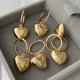 Metal heart charm earrings