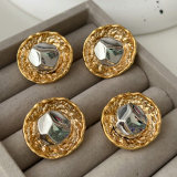 Gold and silver round earrings