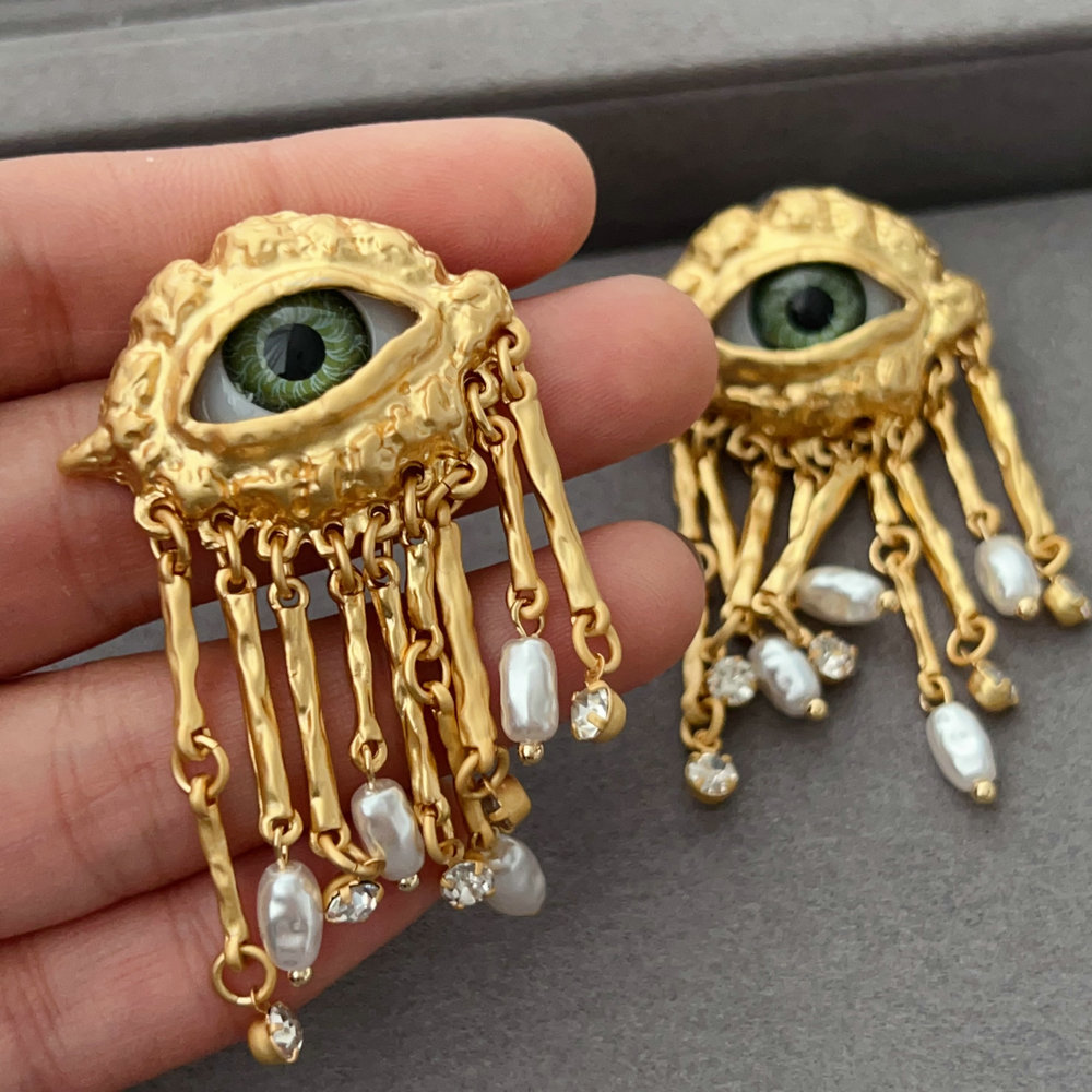 Eye tassel earrings