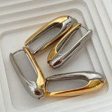 Silver and gold metal oval earrings