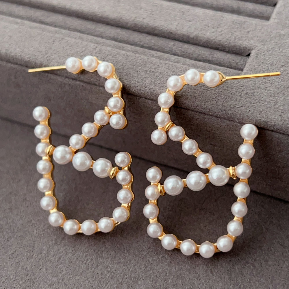 Brand pearl earrings