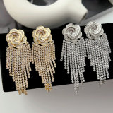Pave flower tassel earrings