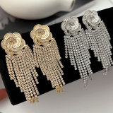 Pave flower tassel earrings
