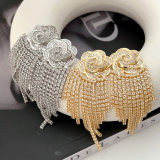 Pave flower tassel earrings