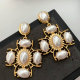 Pearl cross earrings