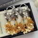 Max star charm earrings