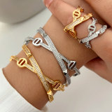 Pave nail cross cuff with ring