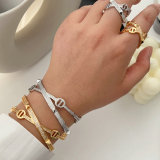 Pave nail cross cuff with ring