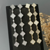 Long pave clover earrings
