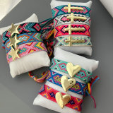 Handmade rope bracelet with star heart cross charm