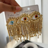 Chunky evil eye tassel earrings