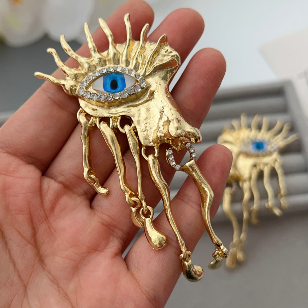 Chunky metal eye earrings