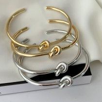 Metal knot cuff