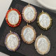 Oval shell religious pendant