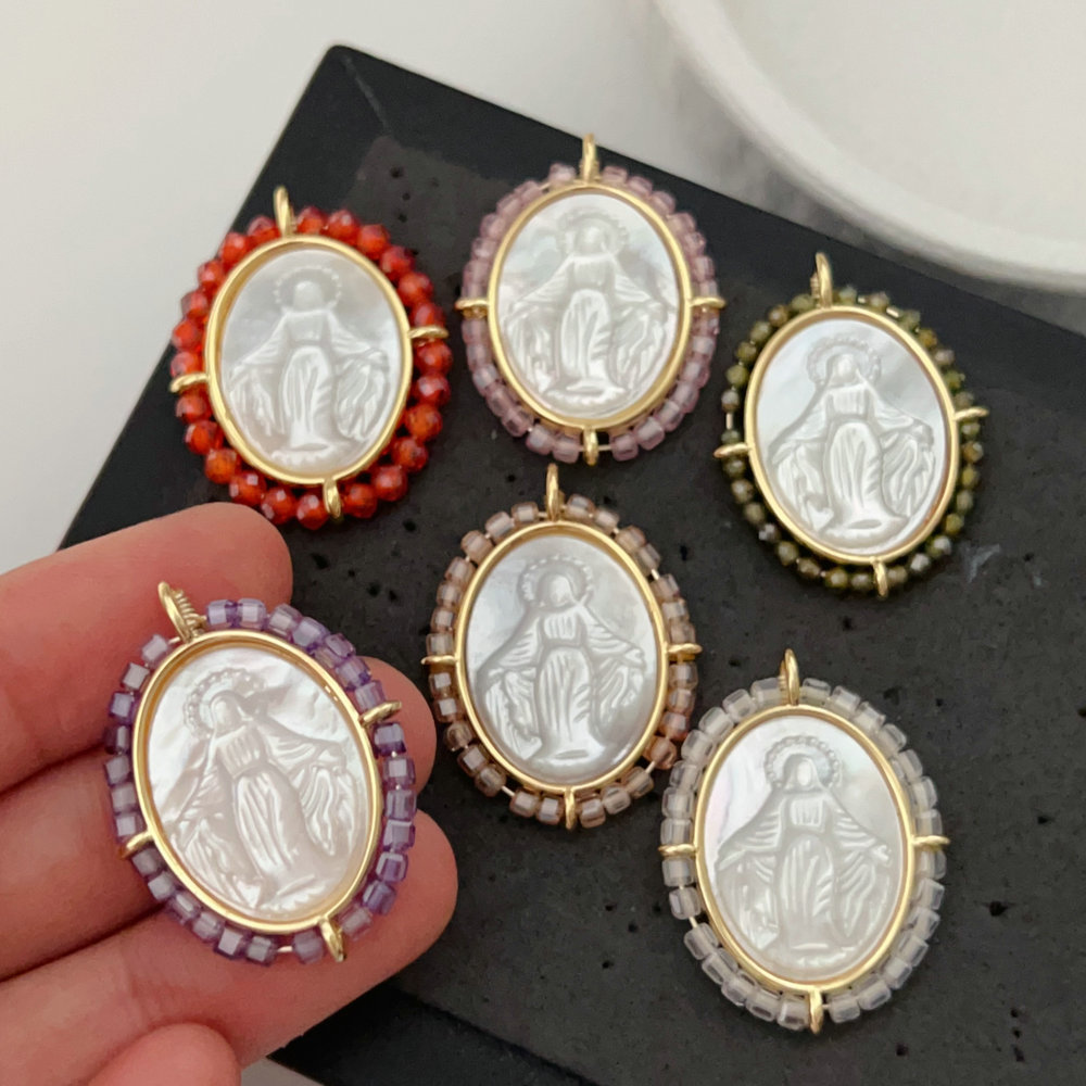 Oval shell religious pendant