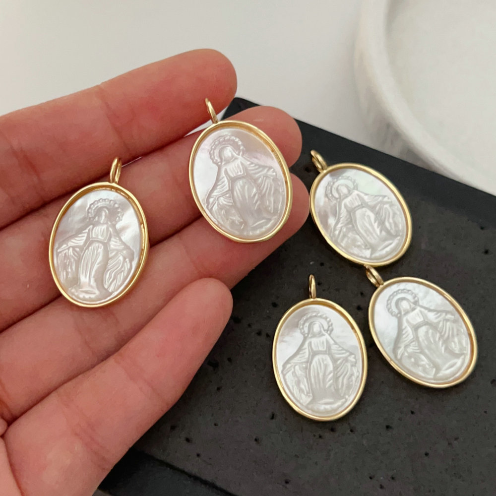 shell religious pendant