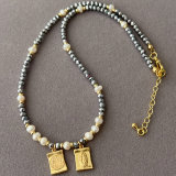 grey chinese crystal necklace with charm