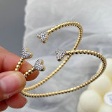 Gold ball heart bangle