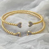 Gold ball heart bangle