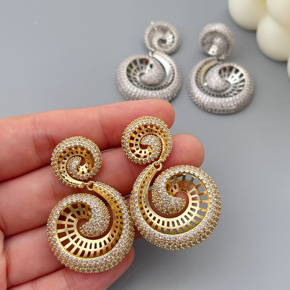 Pave zircon snail earrings