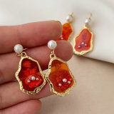 Red charm earrings