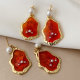 Red charm earrings