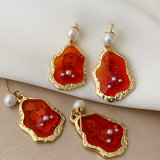 Red charm earrings