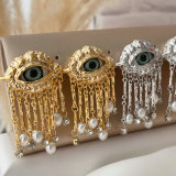 Metal eye tassel earrings