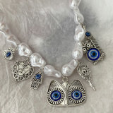 Glass pearl necklace with eye charm