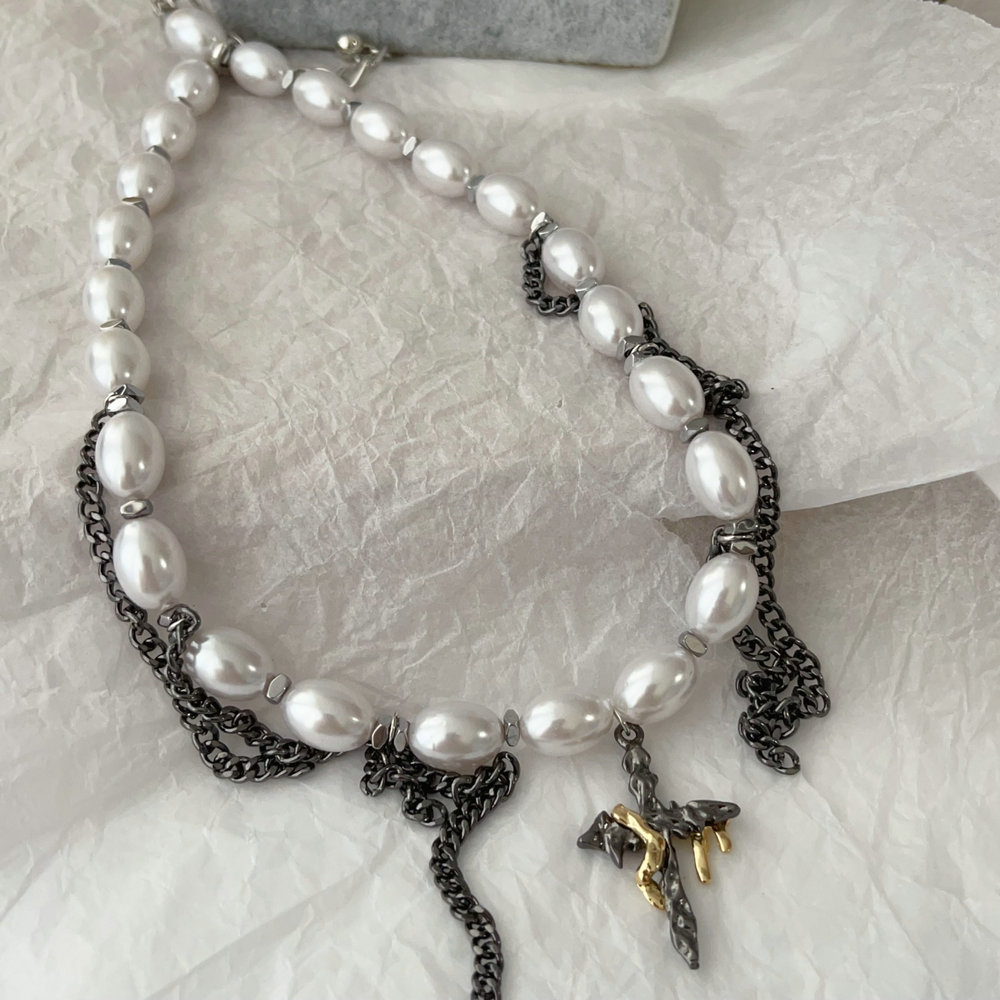 Glass pearl necklace with black chain tassel