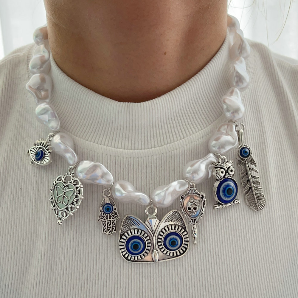 Glass pearl necklace with eye charm