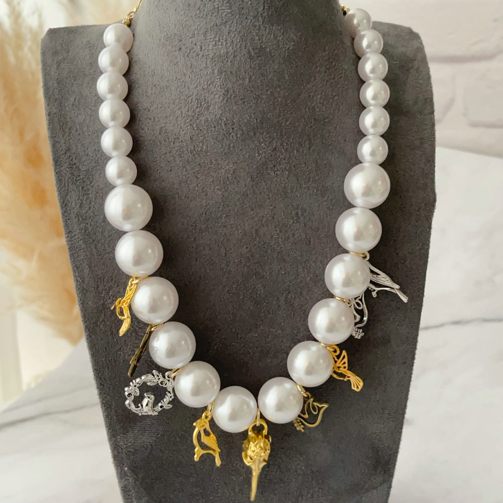 Bird charm necklace