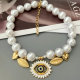 Eye charm Plastic pearl necklace