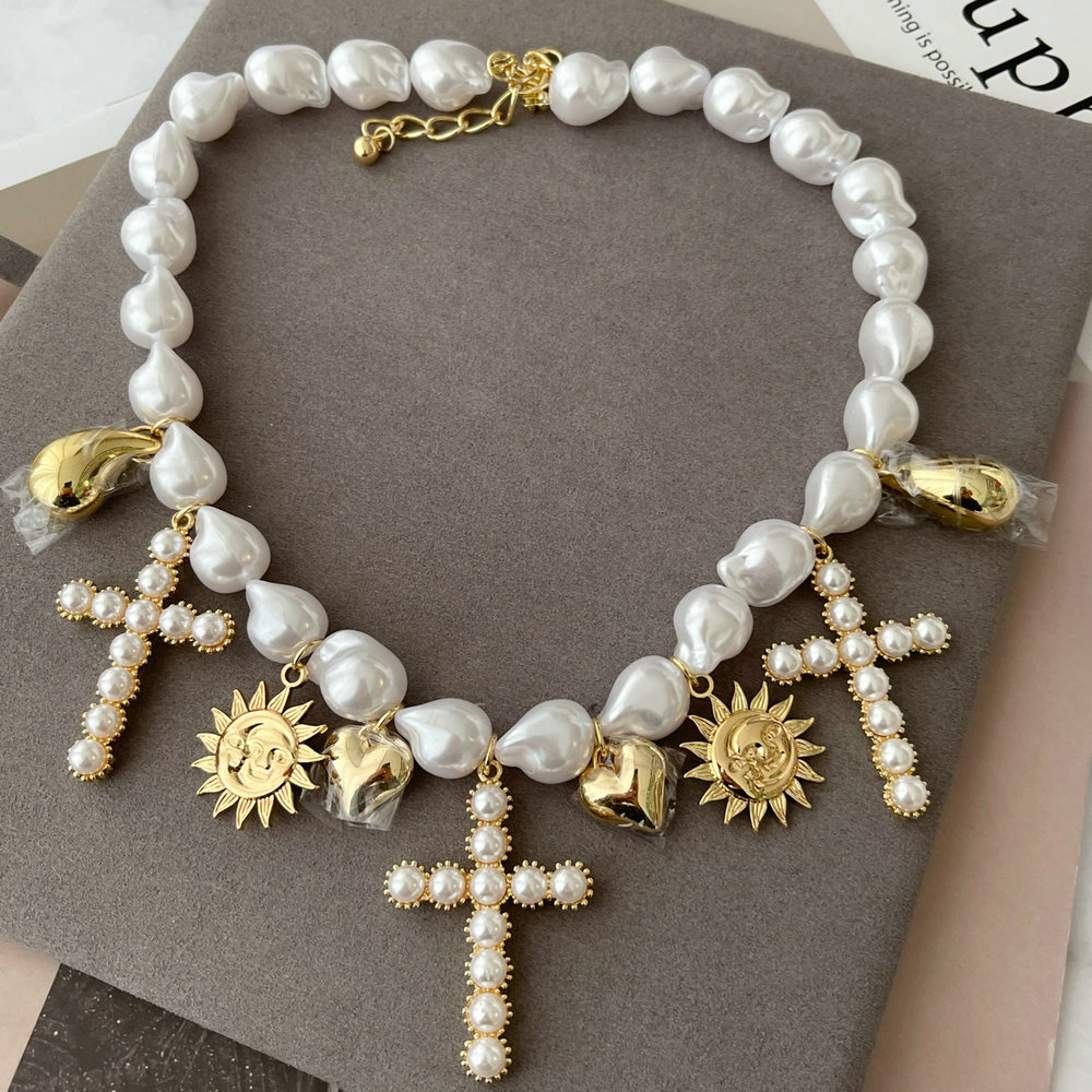 Plastic pearl cross pendant necklace