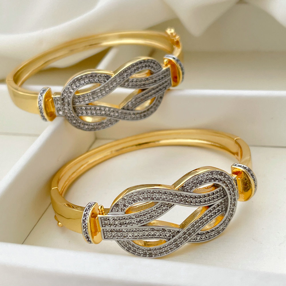 Pave two tone twist bangle