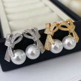 Pave zircon bow pearl earrings
