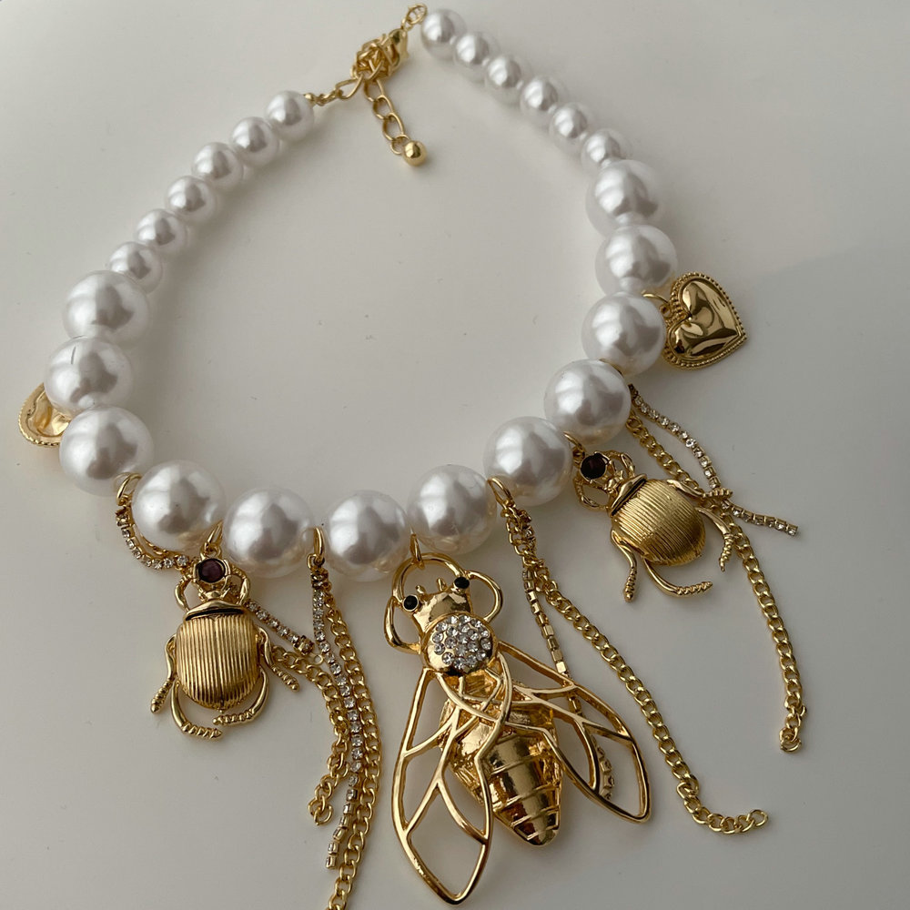 Glass pearl bee charm necklace